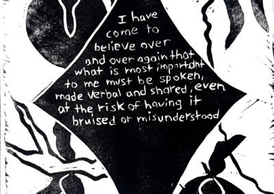 Black and white linocut print with the following quote by Audre Lorde in the center of a star: “I have come to believe over and over again that what is most important to me must be spoken, made verbal and shared, even at the risk of having it bruised or misunderstood.” In the background is a fruit tree.