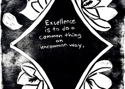 Black and white linocut print with the following quote from Booker T. Washington at the center of a star: “Excellence is to do a common thing in an uncommon way.” Surrounding the star are magnolia flowers and petals.