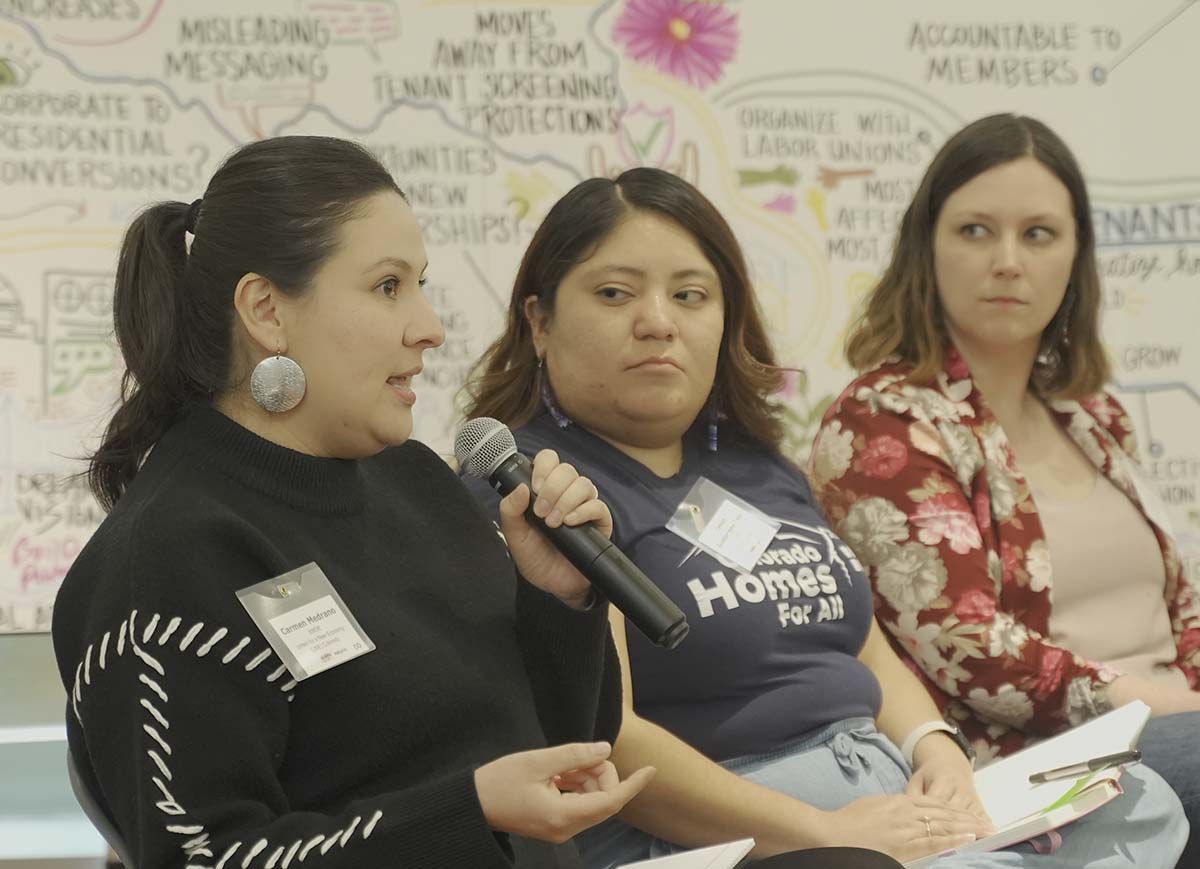 Three women participating in a panel discussion