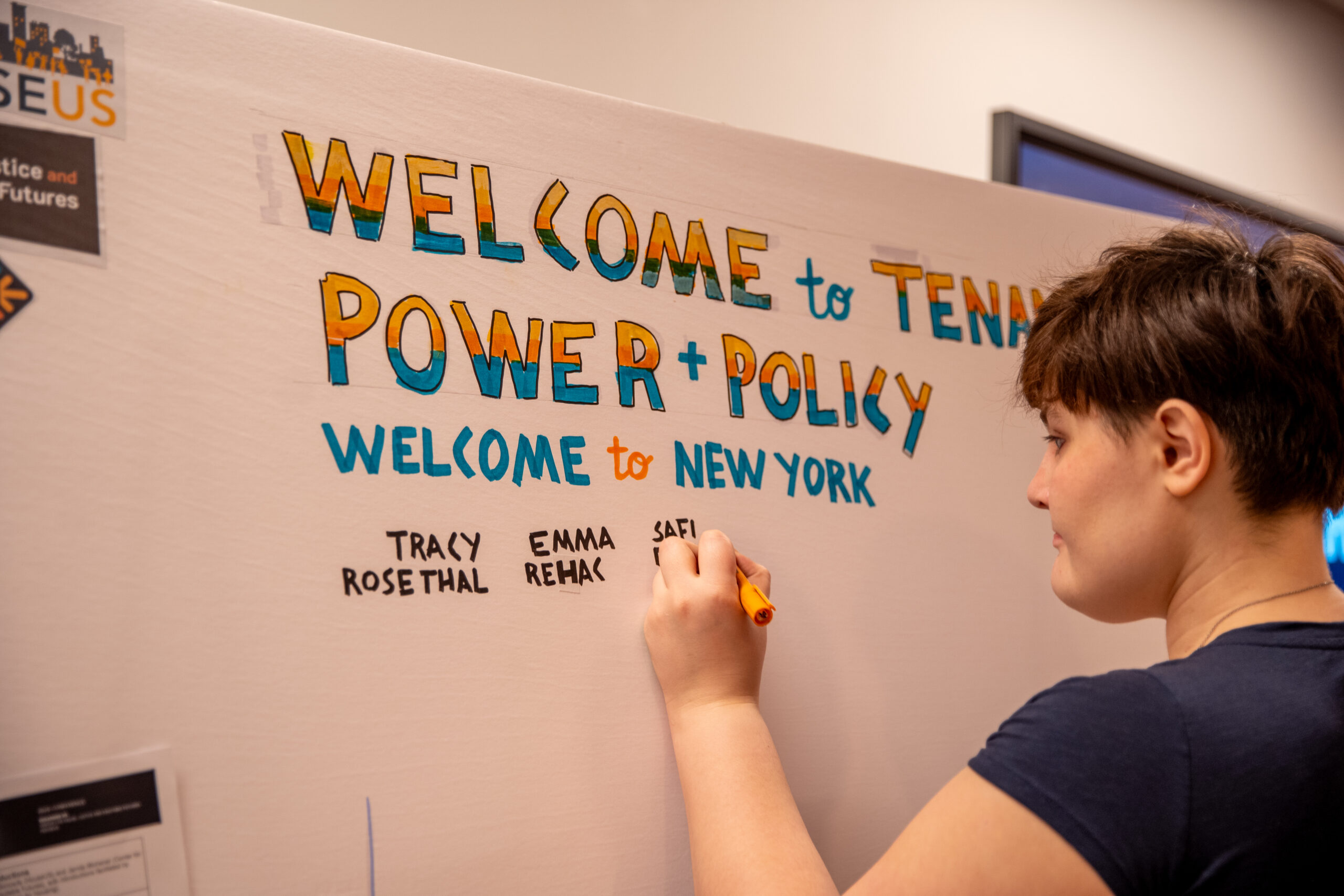 Visual notetaker Angela Krieg with BrightInk writes “welcome to Tenant Policy + Power” in a blue and orange gradient.